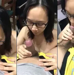 Em gái kính cận nhẹ nhàng chăm chút thằng em bên bàn làm việc